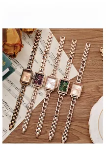 Detail of square GEDI watches with colorful dials and stylish rose gold chain bracelets