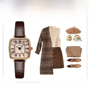 Detail of rose gold rectangular watch with brown crocodile texture leather strap