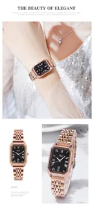 Détail d'une montre rectangulaire en or rose avec cadran noir et guichet de date