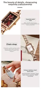 Detailed view of rectangular rose gold watch dial, steel link strap and engraved back