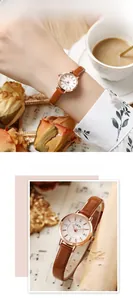 Gros plan d'une montre femme GEDI or rose avec bracelet cuir marron et cadran en strass