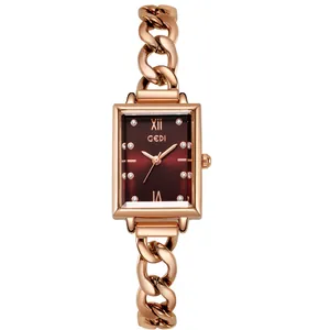 Elegant rose gold rectangular watch with burgundy dial and cuban chain bracelet strap