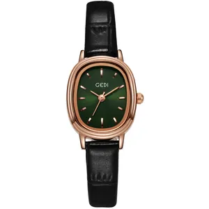 Élégante montre à quartz pour femme avec boîtier ovale en or rose et cadran vert sur cuir