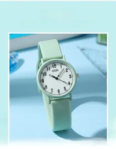 Detail of GEDI mint green quartz watch with silicone strap and numeric dial for students