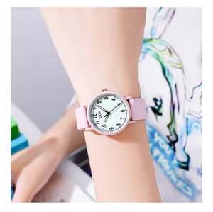 Macro view of GEDI pink silicone watch with white dial and clear Arabic numerals