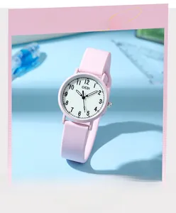 Close-up of pink silicone quartz watch for students with white dial and numeric markers