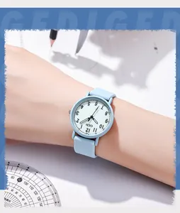 Close-up of a light blue silicone strap quartz watch worn in a school study setting