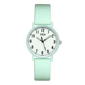 Minimalist mint green quartz watch with silicone strap and easy-to-read numeric dial