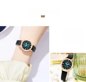 Detail showing green gradient dial with crystals and date window on a leather strap watch