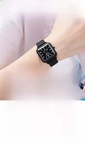 Detailed view of women's black square quartz watch with silicone jelly strap