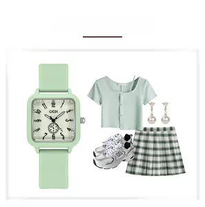 Luminous mint green square watch shown with matching casual outfit and sneakers