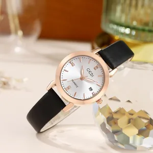 Elegant GEDI women's quartz watch with rose gold case and black leather strap shown on crystal