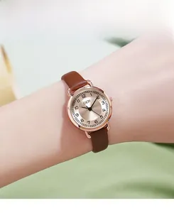 Close-up of GEDI retro leather watch with rose gold case and Arabic numeral dial
