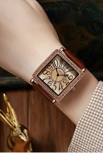 Close-up of GEDI luxury square watch featuring a diamond bezel and champagne wavy dial
