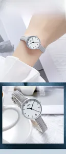 Close-up of elegant ladies' GEDI watch with grey leather strap and white round dial