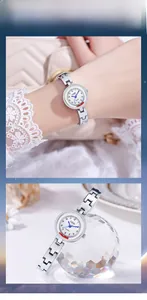 Close-up of GEDI women's silver quartz watch with white dial and H-link metal bracelet