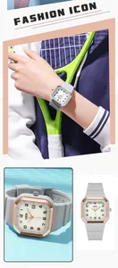 Détails macro d'une montre à quartz carrée avec bracelet en silicone et guichet de date