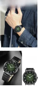 Detail showing GEDI men's vintage watch with green gradient dial and black leather strap