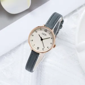 Minimalist GEDI women's watch with rose gold case, cream dial and slim grey leather strap