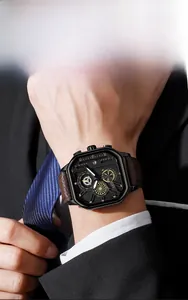 Vue détaillée d'une montre en cuir à grand cadran avec date sur un homme en costume