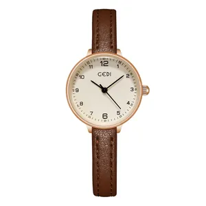 Minimalist women's quartz watch with rose gold round case and brown leather strap