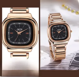 Detailed macro view of the minimalist rose gold stainless steel watch and its soft strap link