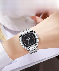 Elegant silver square quartz watch with black dial worn by model for luxury lifestyle view