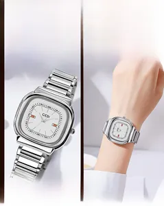 Detail of silver square stainless steel watch with polished links and minimalist dial