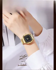 Elegant gold square quartz watch with black dial worn by a woman for a chic look