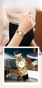 Detail of Gedi square watch with leather crocodile strap and gold horseshoe metal accents