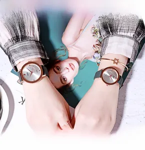 Close-up of GEDI women quartz watch with grey leather strap and rose gold jewelry sets