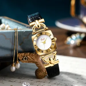 Elegant vintage square watch with pearl dial, golden case, and black leather strap