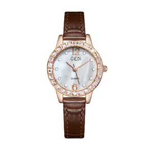 Elegant women's quartz watch with a rose gold crystal bezel and brown leather strap