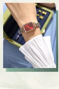 Elegant square rose gold watch with red sunray dial and two-tone stainless steel strap