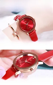 Detail of red leather strap watch with rose gold case and sparkling sunray dial texture