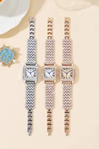 Detailed view of square GEDI watches with rhinestone encrusted bezels and Roman dials