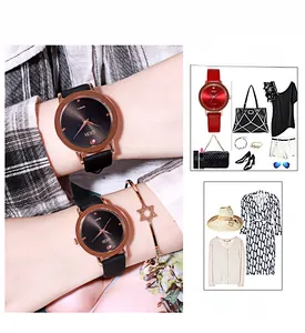 Detail of GEDI women's quartz watch with black leather strap and gold star bracelet
