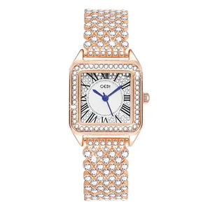 Macro detail of luxury square watch featuring rose gold pavé crystals and white dial