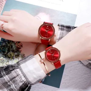 Elegant pair of GEDI quartz watches with red sunray dials and leather straps on models