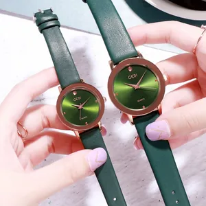 Green and rose gold quartz watches with leather straps and minimalist sunray dial