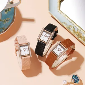 Detail of square quartz watches with diamond bezels and quilted leather straps in three colors