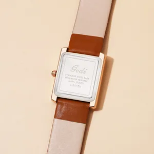 Detailed macro view showing the stainless steel back case and leather strap of the watch