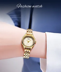Elegant gold barrel-shaped quartz watch shown on a woman wrist with a metal link chain