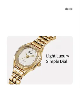 Detail view of Gedi tonneau quartz watch with gold metal band and textured dial