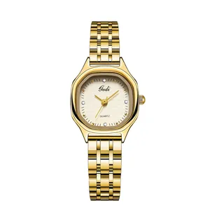 Elegant gold tonneau quartz watch for women with textured dial and crystal markers
