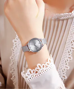 Detail showing the silver Milanese mesh strap and sleek oval dial of the quartz watch