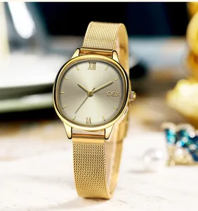 Elegant gold oval women's watch with champagne dial and stainless steel mesh strap