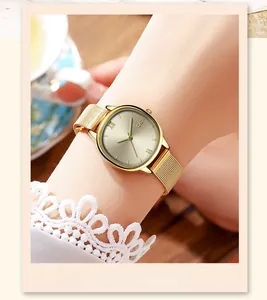 Elegant gold GEDI oval quartz watch with Milanese mesh strap on a female wrist