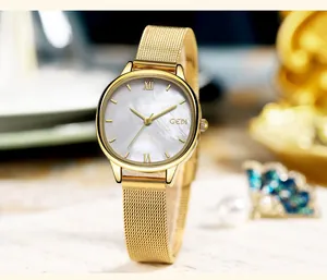 Detail of GEDI oval women's watch with gold mesh strap and mother of pearl dial face