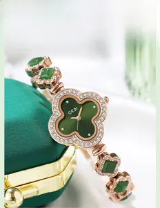 Close-up of four-leaf clover green sunray watch dial with rose gold diamond accents